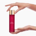 Advert for Carolina Herrera La Bomba Shimmering Body Oil