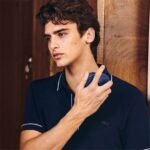 Model holding Lacoste L.12.12 Bleu