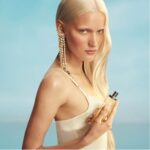 Mugler model with Starlicious Pineapple Musk bottle